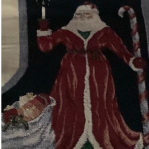 Tapestry Christmas Stocking Panel Santa holding a candle,cane and bag of gifts.